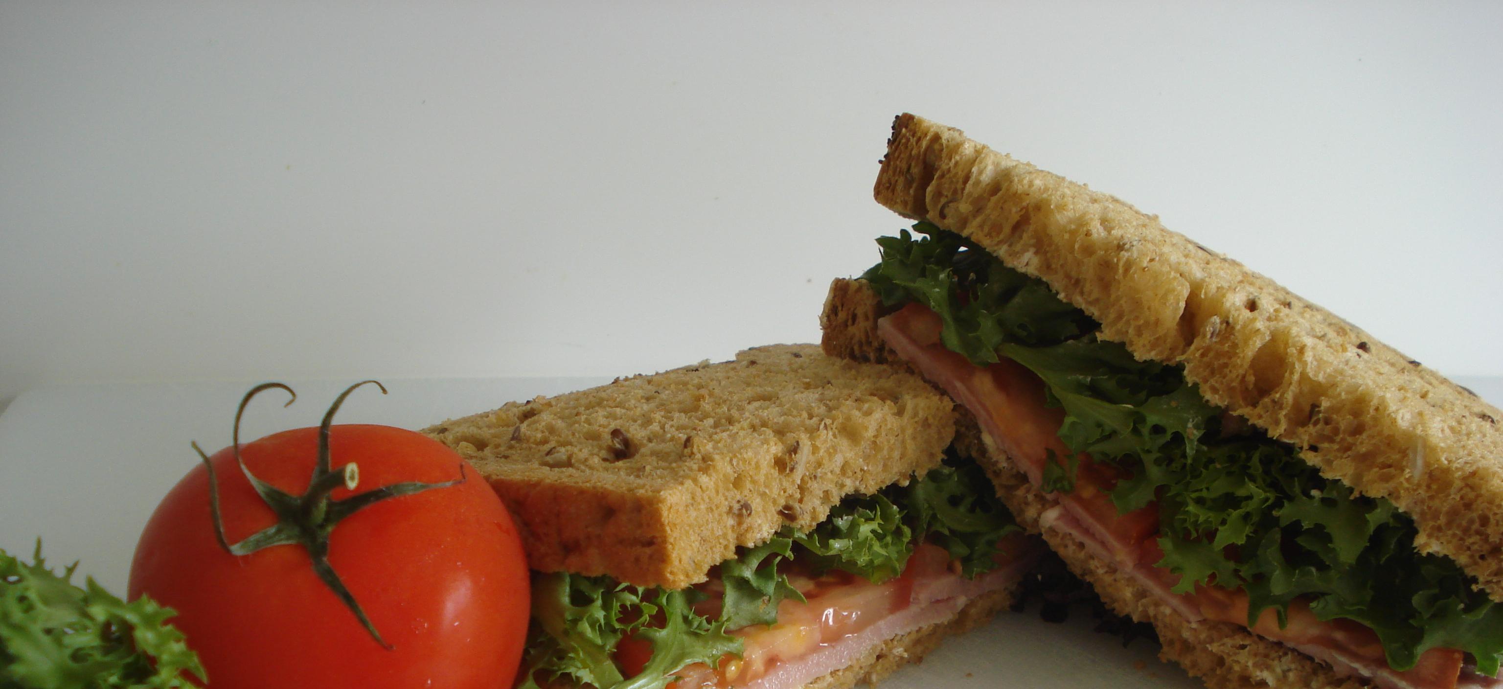 Picture of our sandwich of the week, bacon, lettuce and tomato in multigrain bread